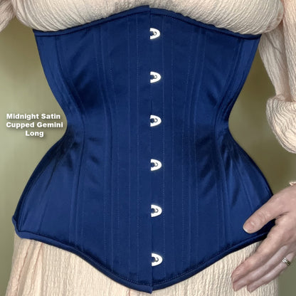 Midnight blue satin Gemini Cupped Long corset with silver busk on a neutral background