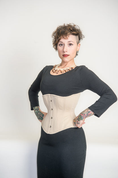 Beige cotton Libra corset, side view on model