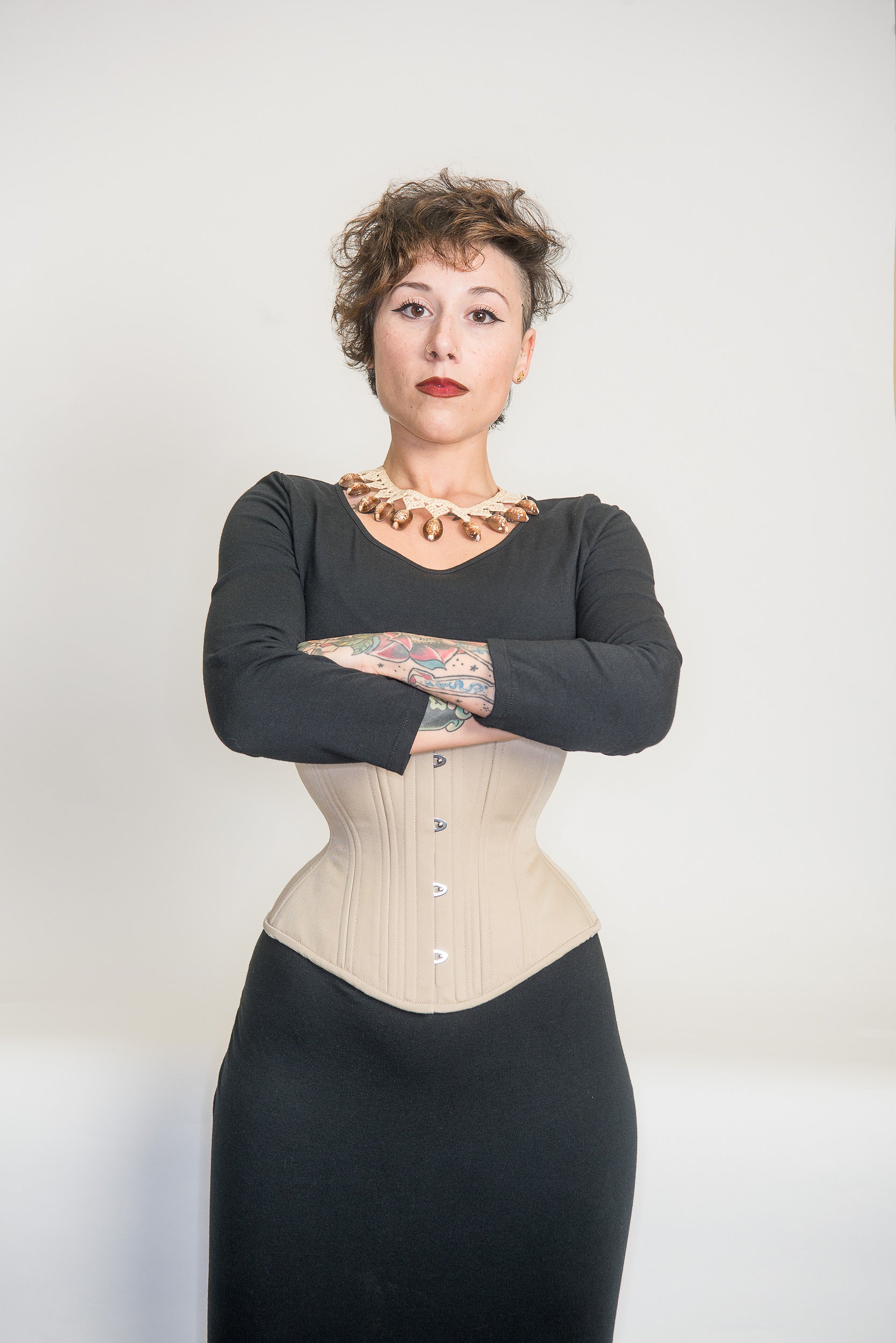 Beige cotton Libra corset, front view on model