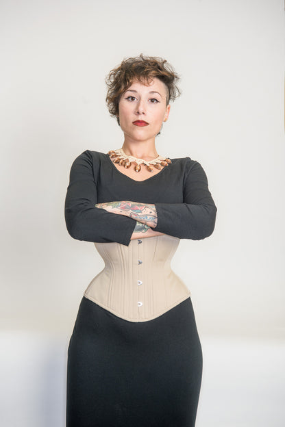 Beige cotton Libra corset, front view on model