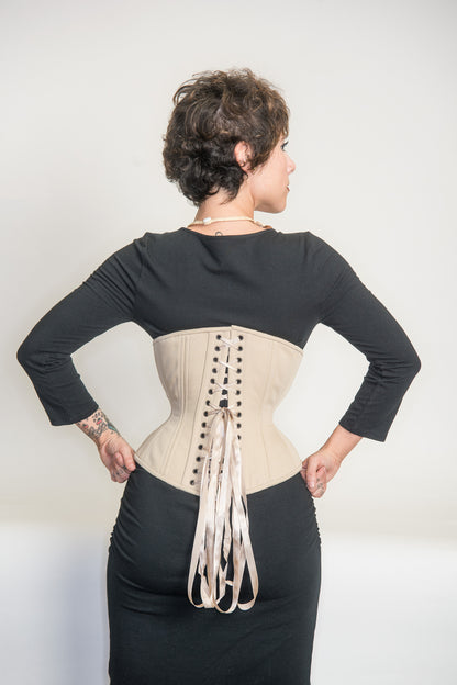 Beige cotton Libra corset, back view on model