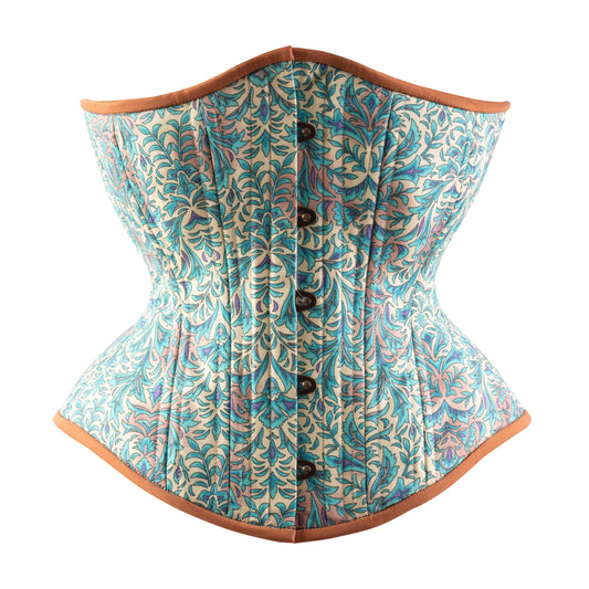 A bohemian style teal hourglass corset with brown trim and floral cotton print, front view.