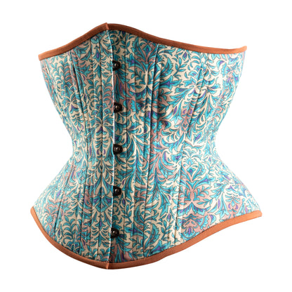 A bohemian style teal hourglass corset with brown trim and floral cotton print, side view.