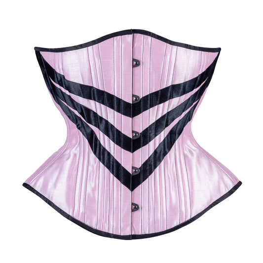 A light pink satin corset with black ribbon chevron details and black trim, hourglass silhouette, regular underbust length, front view with busk closure